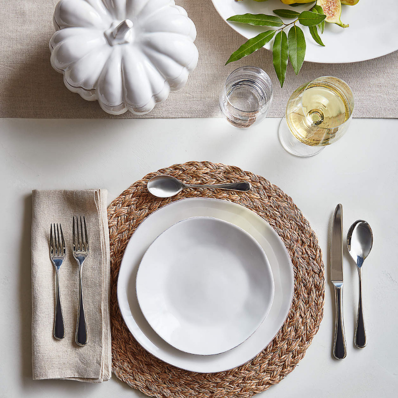 White & neutral toned table setting with linen napkins from Crate & Barrel