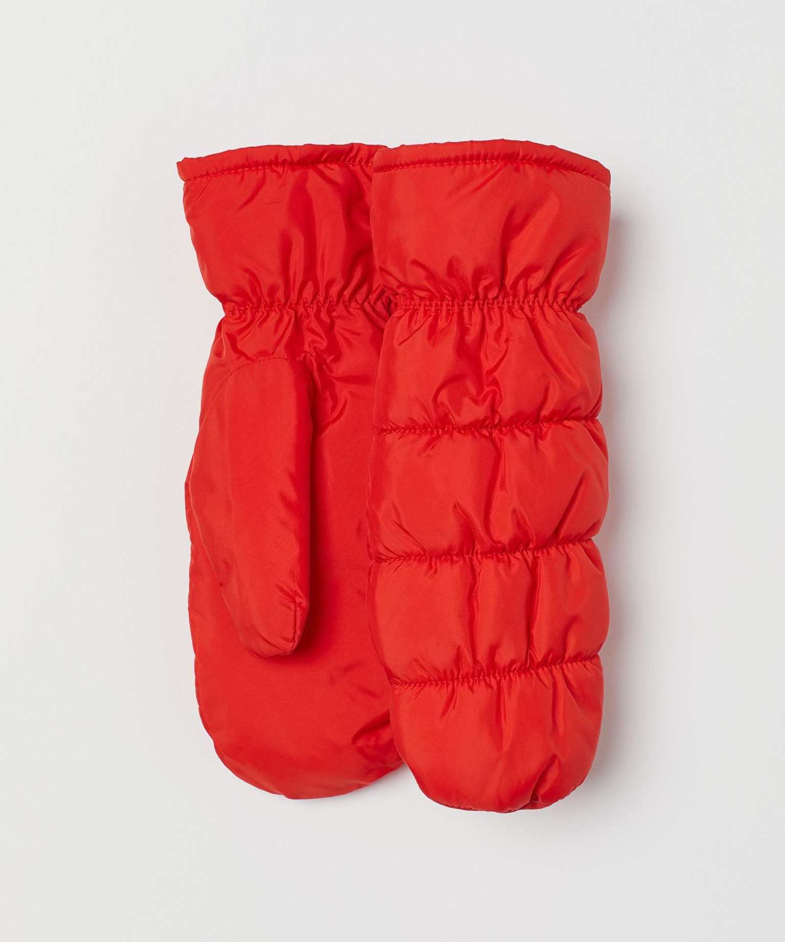 Image of a pair of red quilted H&M mittens