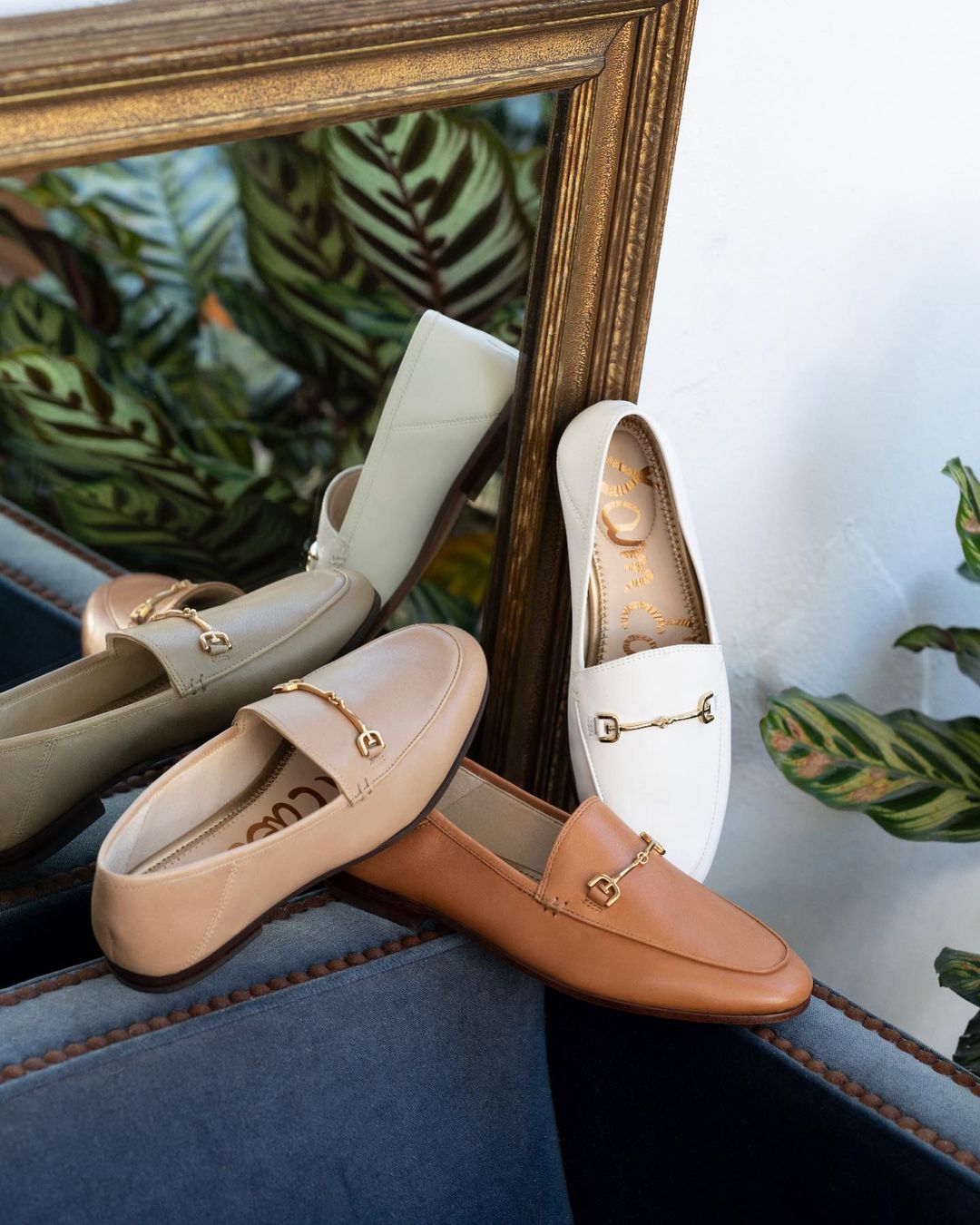 lifestyle imgae of sam edelman loafers in beige, brown and white.