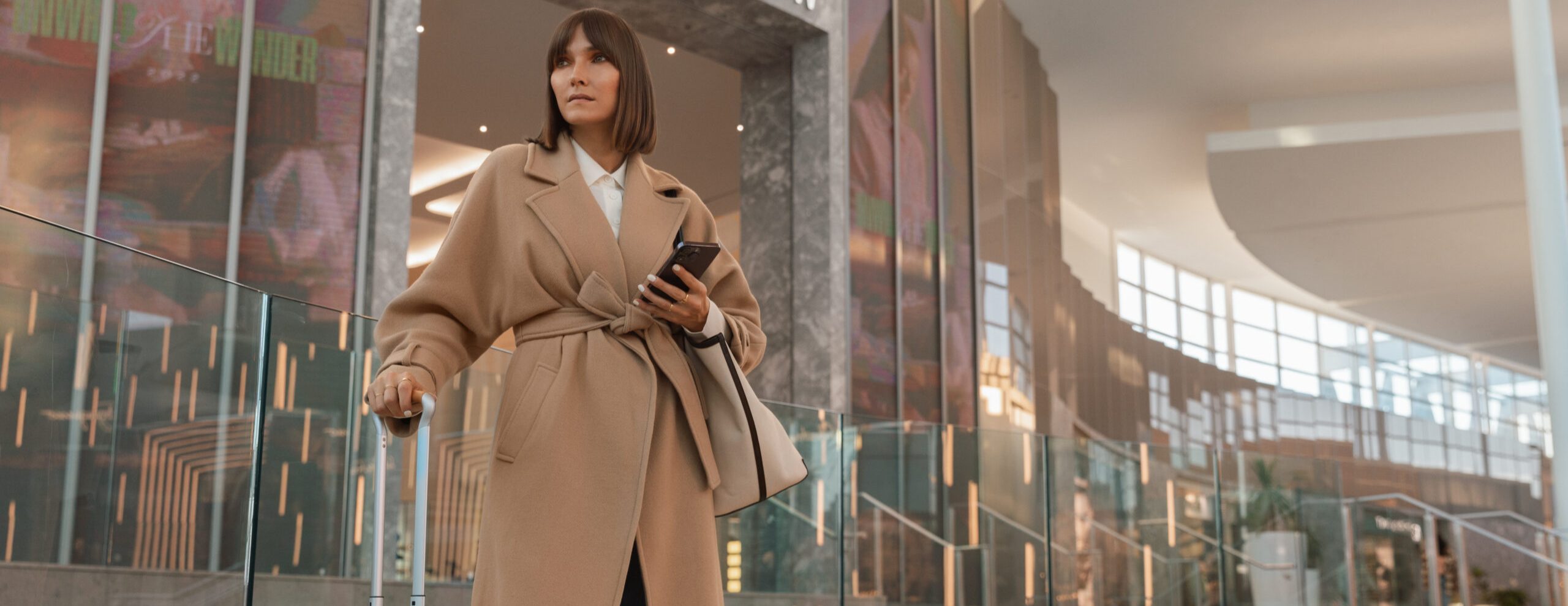 Woman standing outside of a store in a shopping mall