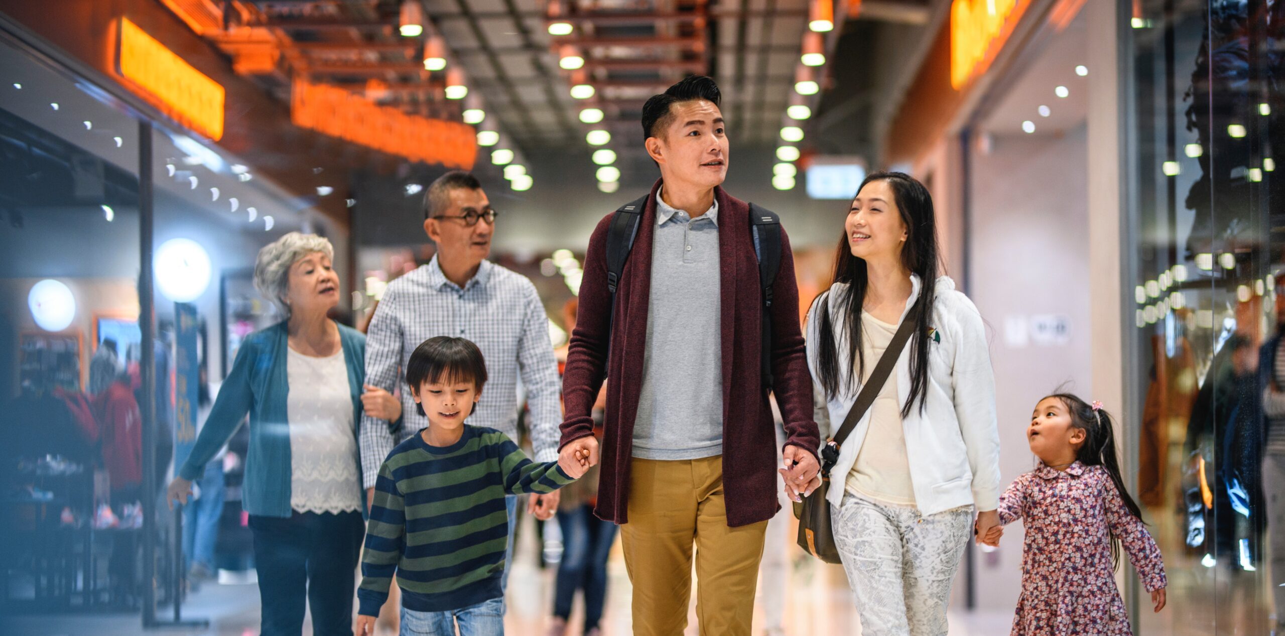 A family walking through a shopping mall
