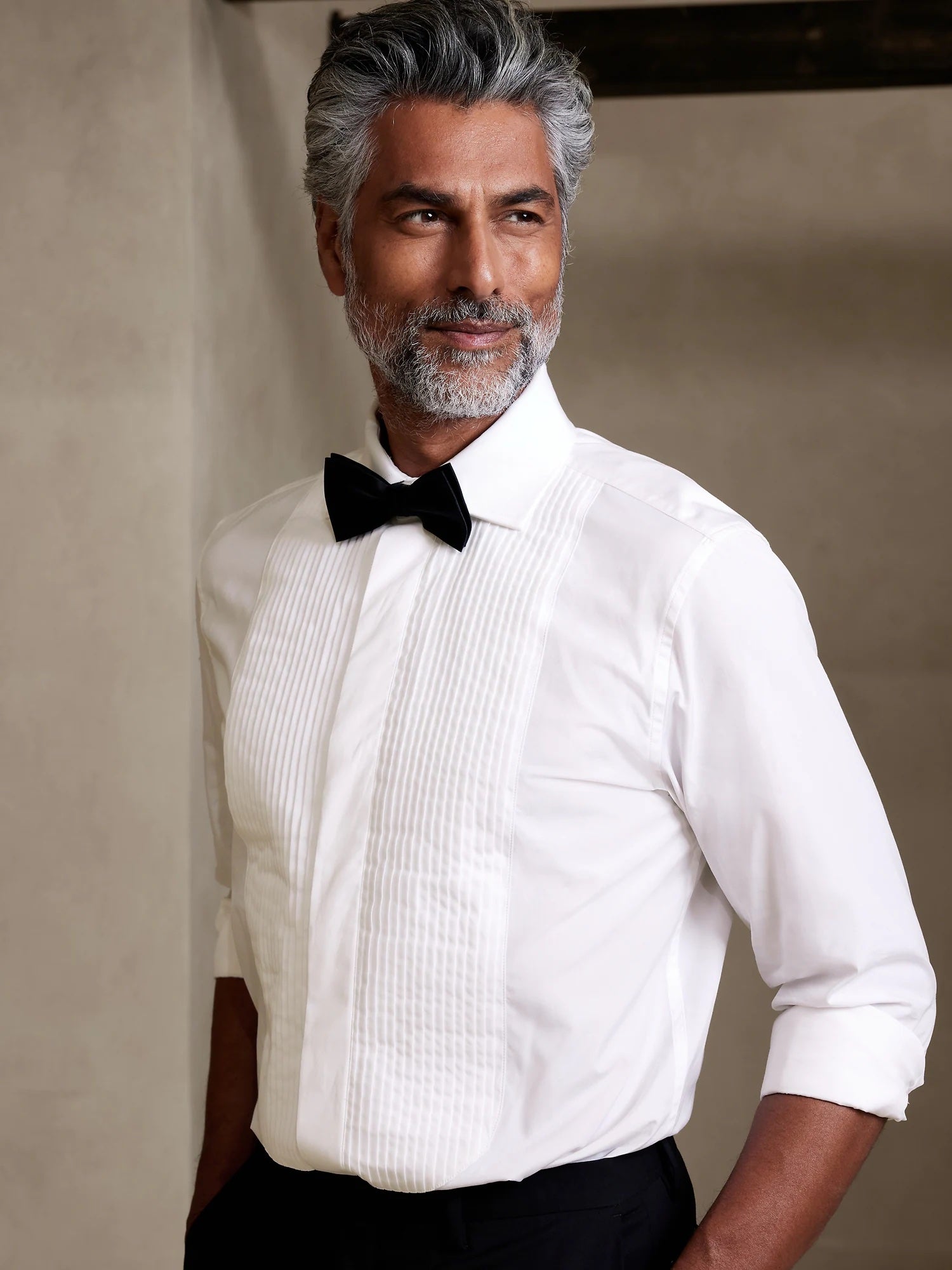 image of a man wearing a white dress shirt with a black bow tie