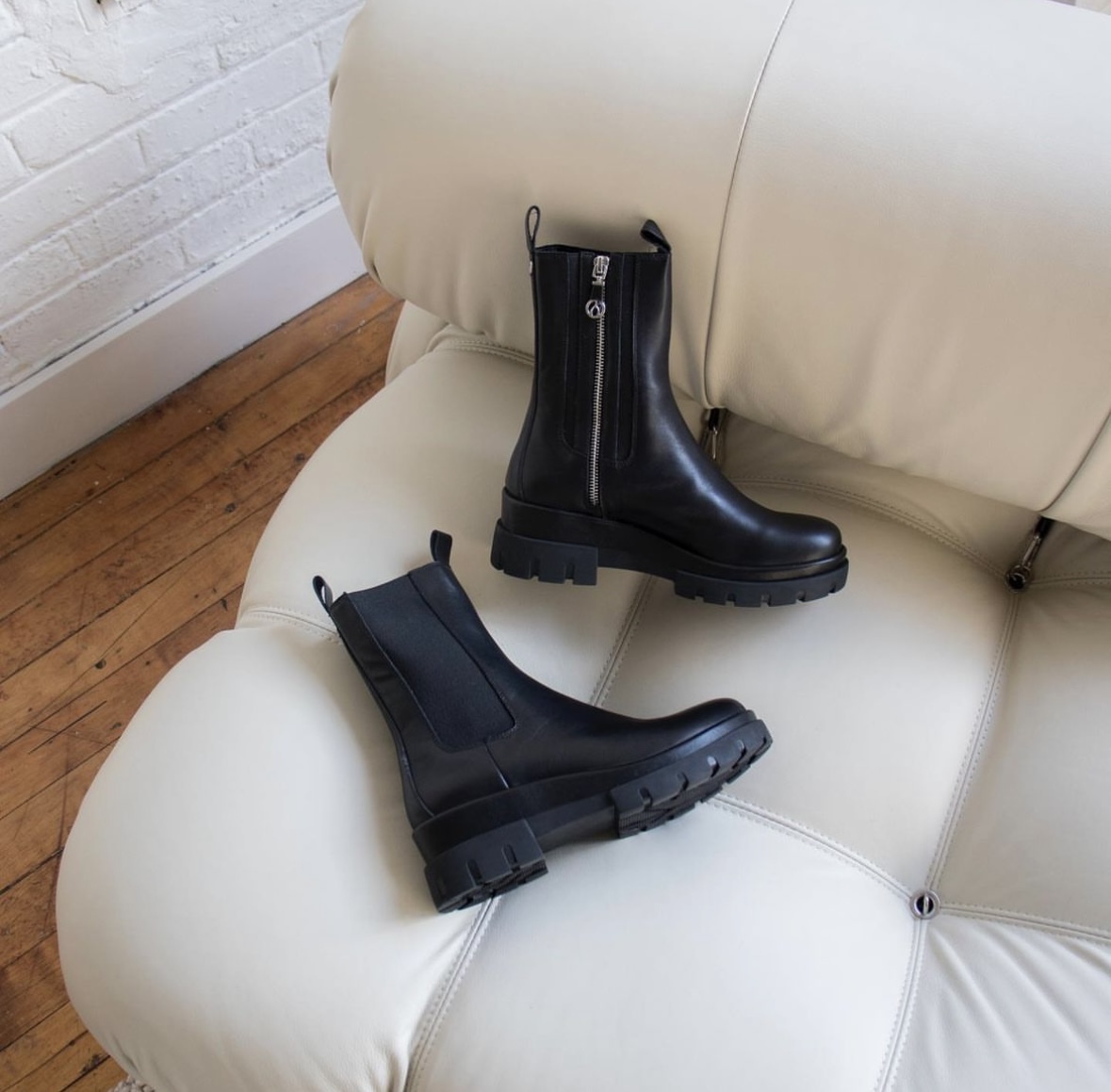 High cut, black leather boots with a zipper from Browns