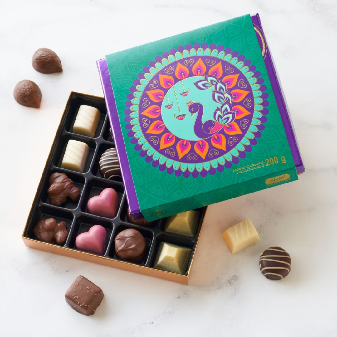 A box of chocolates with a Diwali themed cover