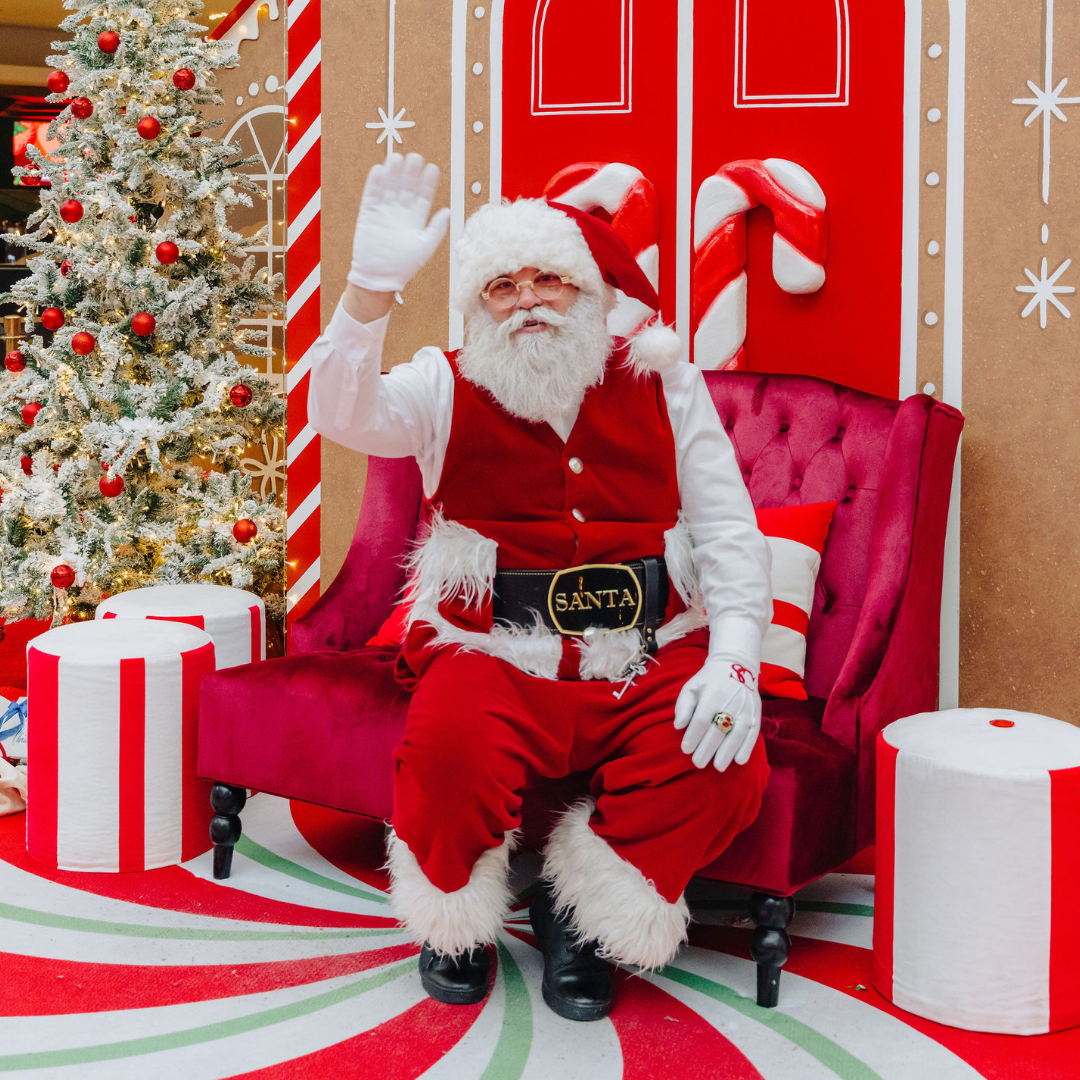 Santa sitting and waving