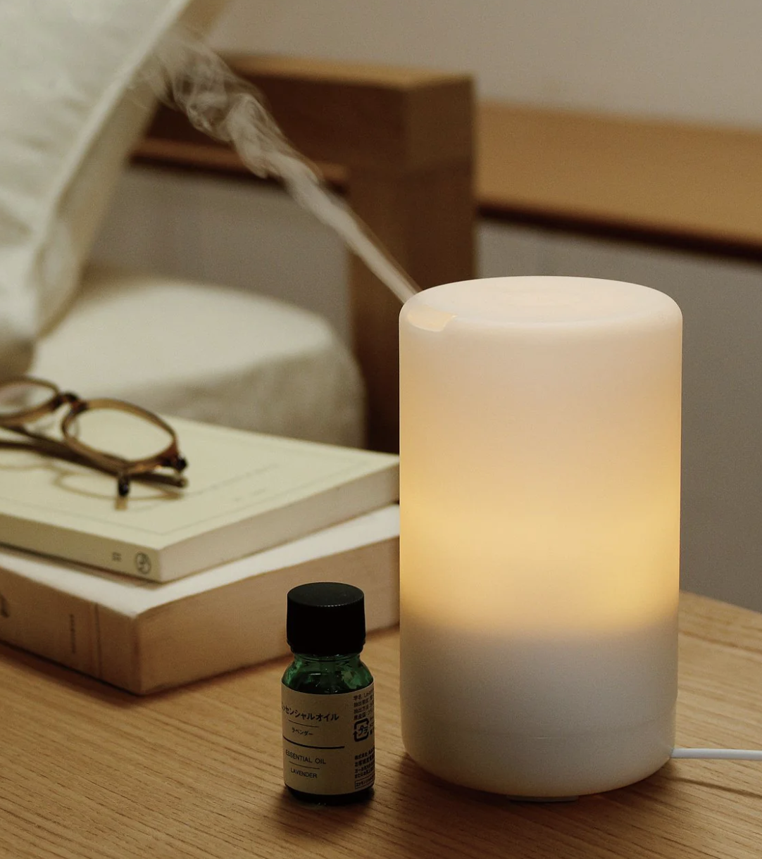 A diffuser on a bedside table
