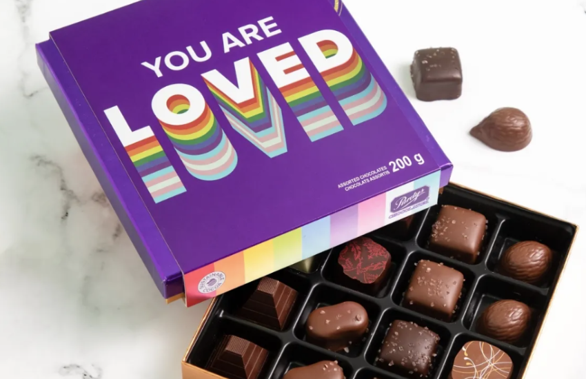 A box of chocolates featuring the phrase 'You Are Loved' on the lid