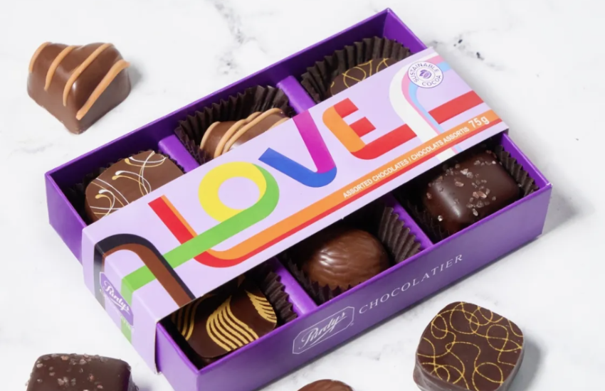 A box of chocolates featuring the word 'LOVE' on the lid