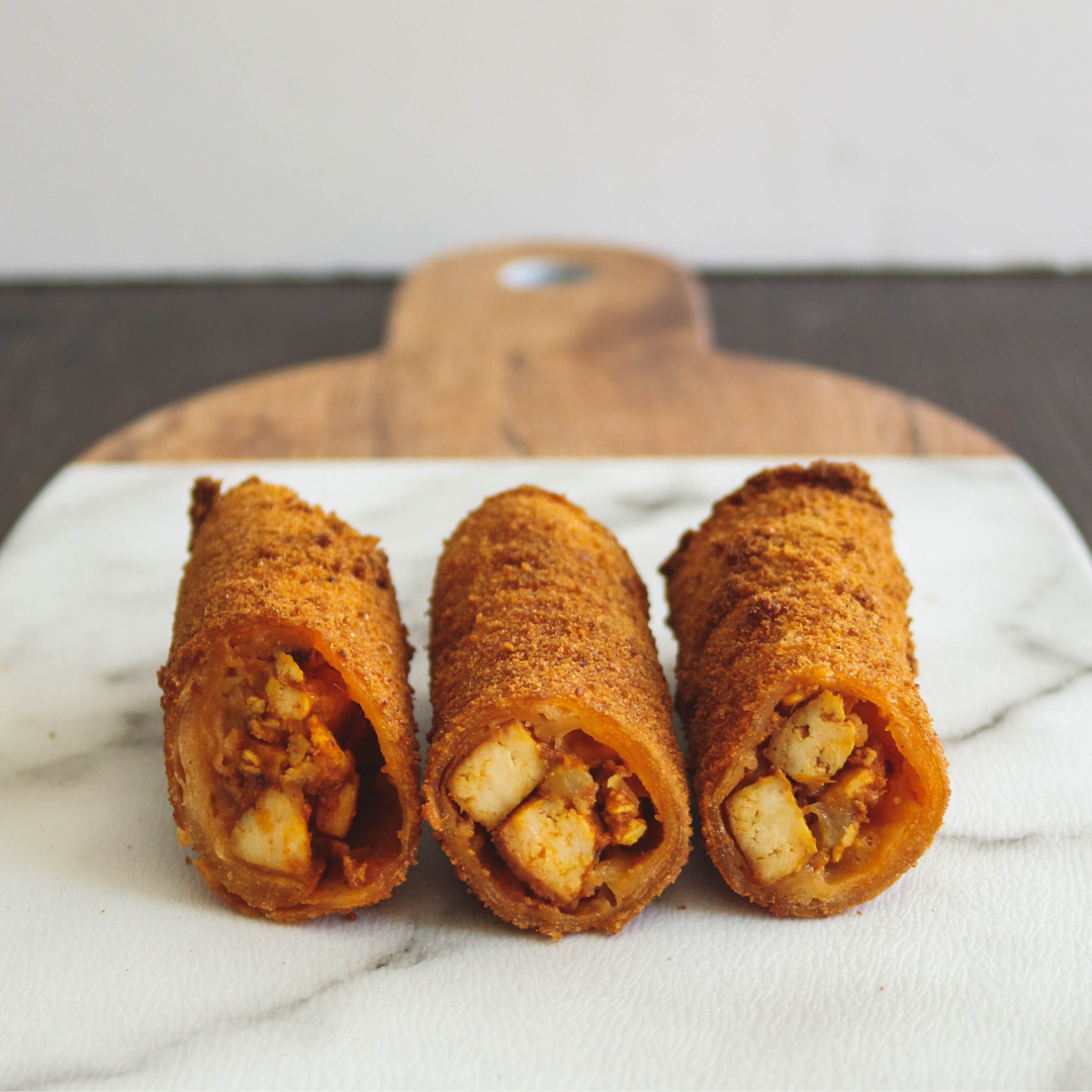 Deep fried Sri Lankan roll on a marble dish