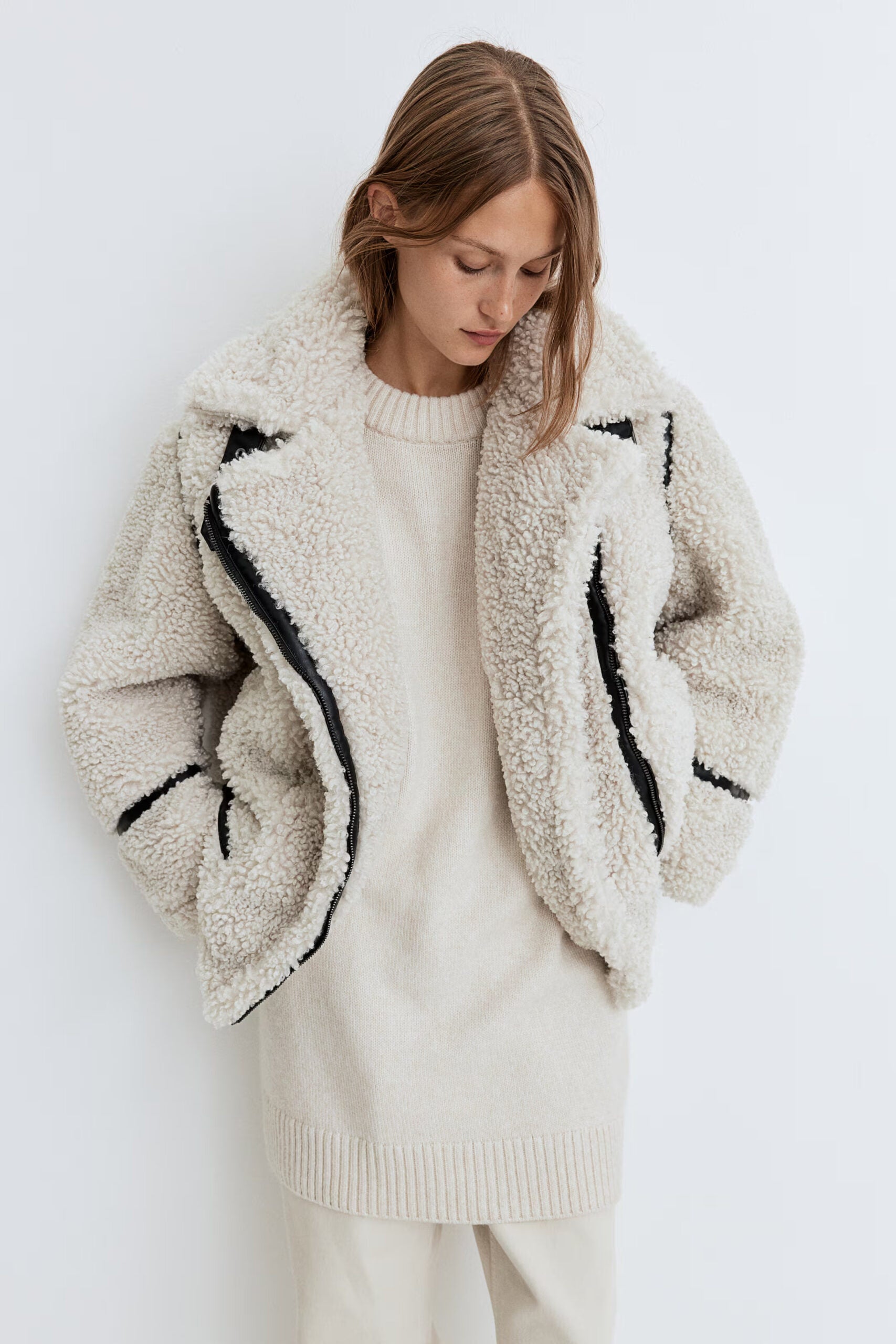 Woman in white fluffy jacket