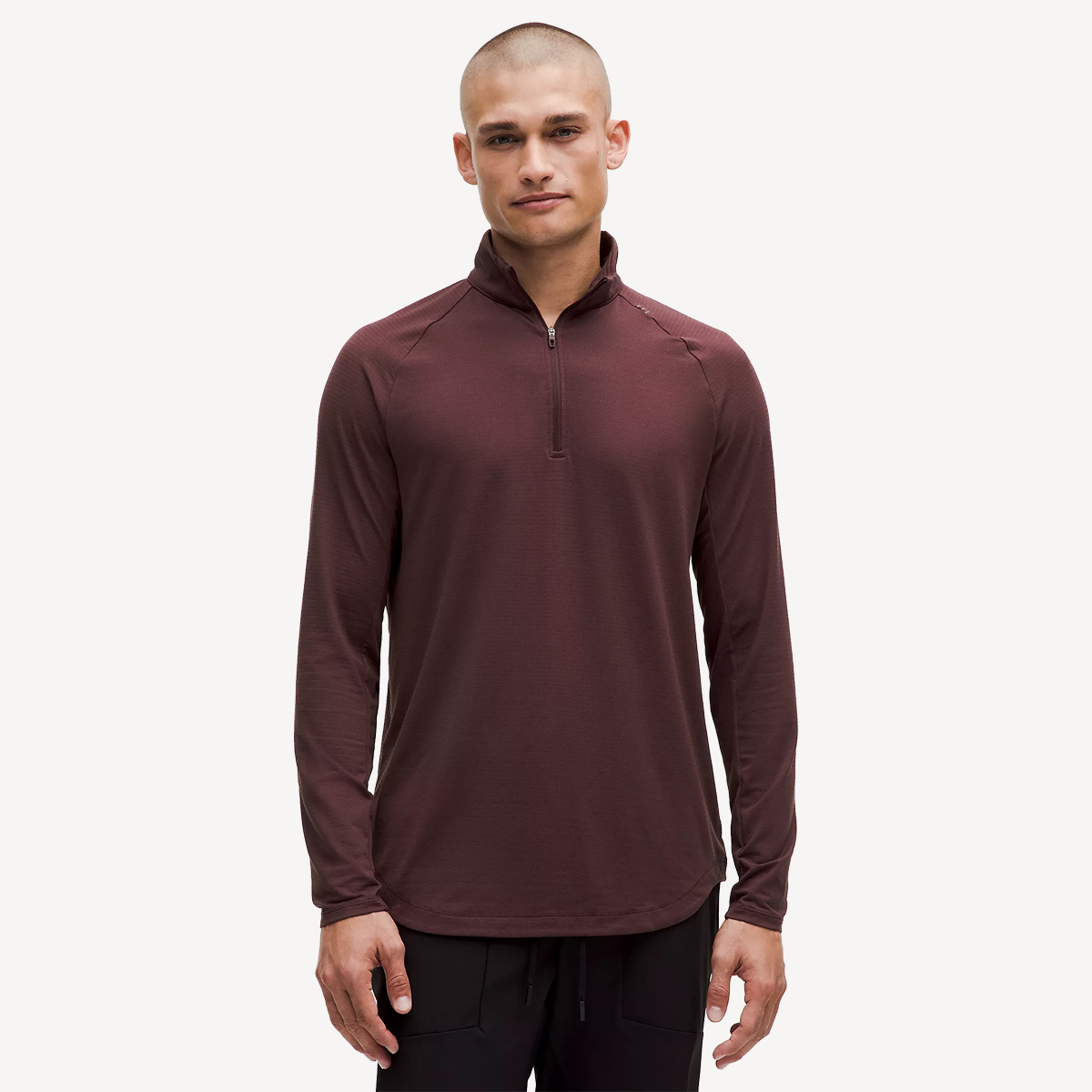 Man in a burgundy half-zip shirt