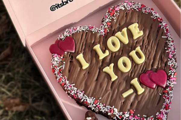 A heart shaped brownie with the message 'I Love You' on it.