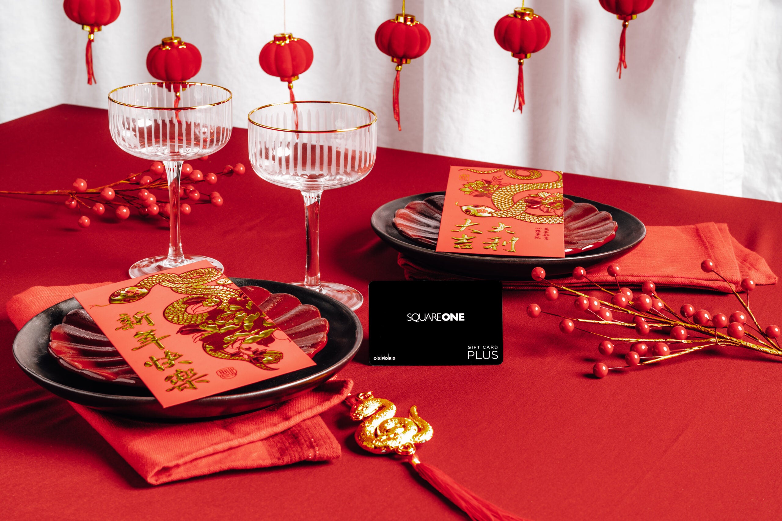 A Square One gift card in the middle of a festive Lunar New Year tablescape.