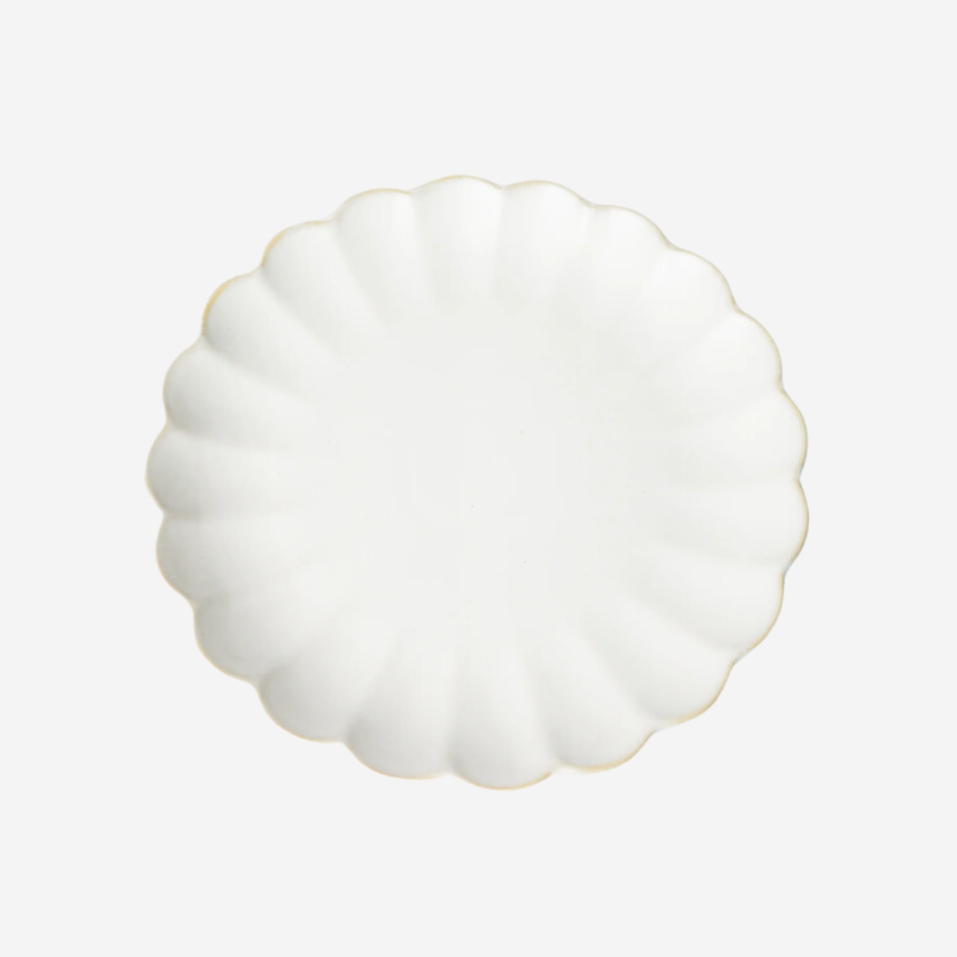 A white scalloped plate