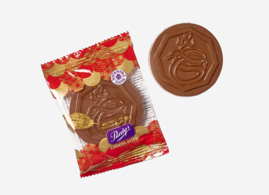 A chocolate coin packed in a red wrapper.