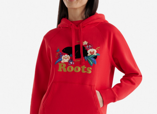 A red hoodie with a floral motif design on the chest.