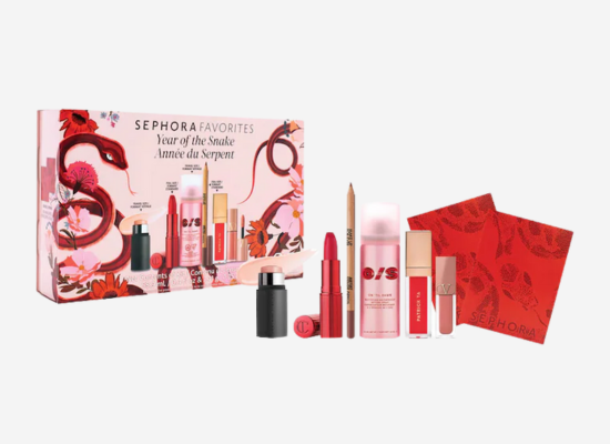 A pink makeup set with a red snake design on the cover.