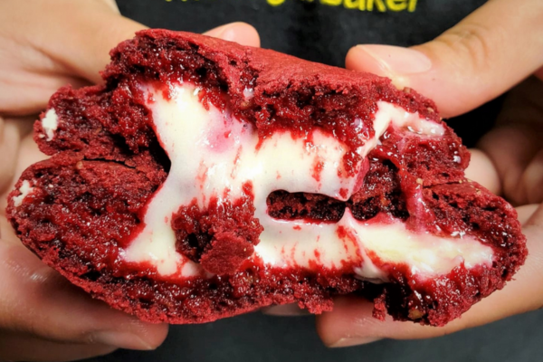 The inside of a chewy red velvet cookie.