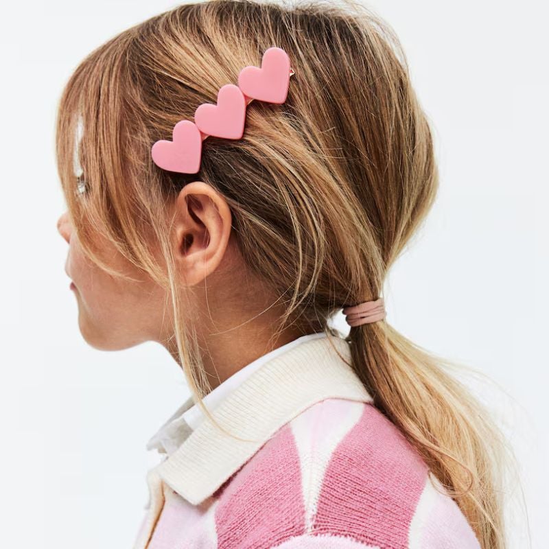 Girl with heart hair clips