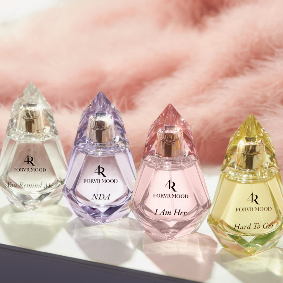 Four perfume bottles lined up.