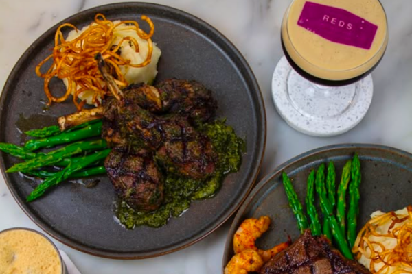 A plate of steak, mashed potatoes and vegetables.