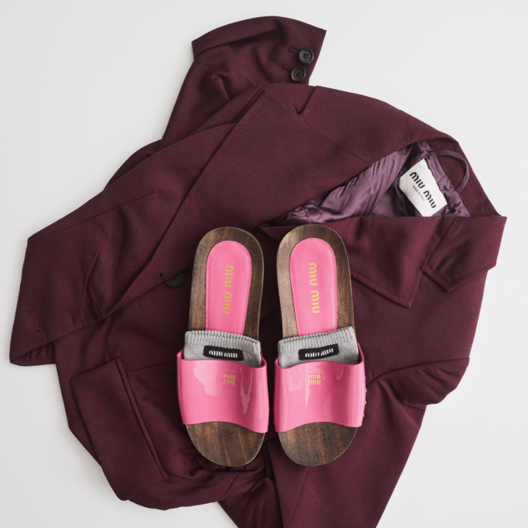 Pink and brown flip flops and a burgundy blazer.