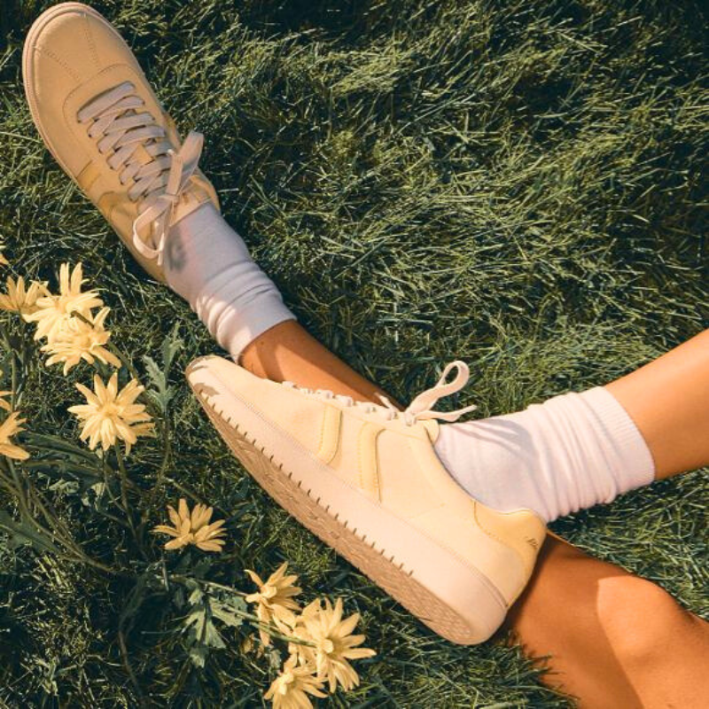 A pair of light yellow sneakers.