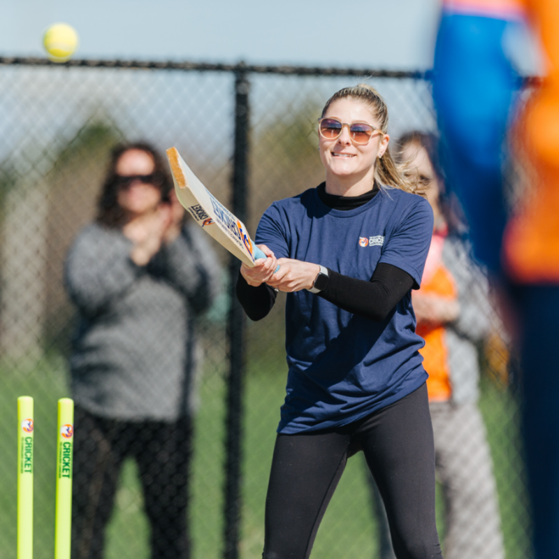 A woman playing cricket.