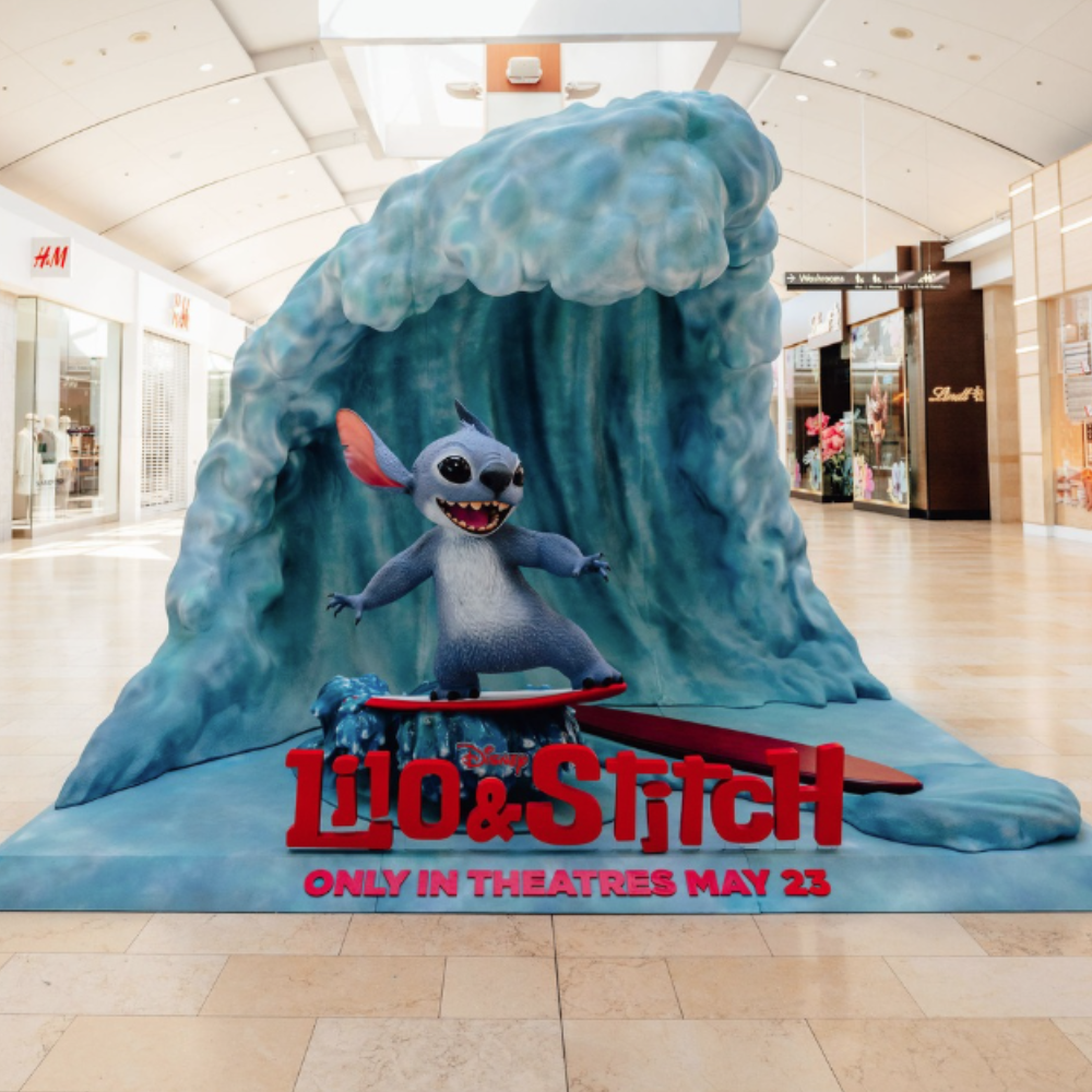 A surfing photo-op with Stitch from Lilo and Stitch.