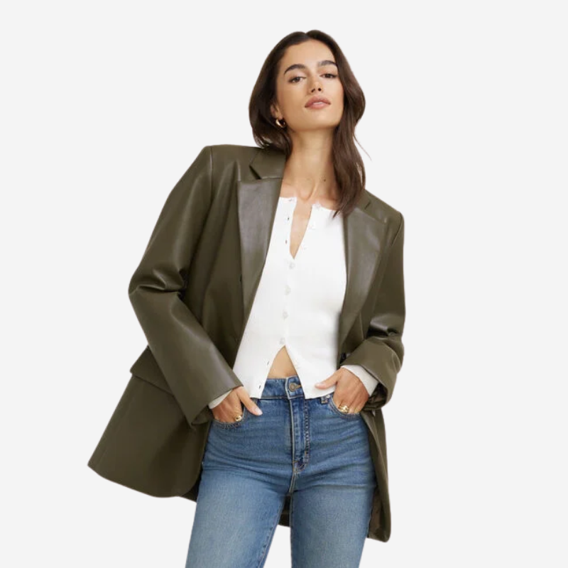 A woman wearing an oversized faux leather blazer