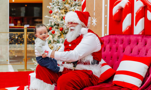 Santa taking a photo with a baby.