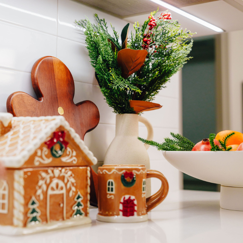A kitchen counter decorated with holiday decor.