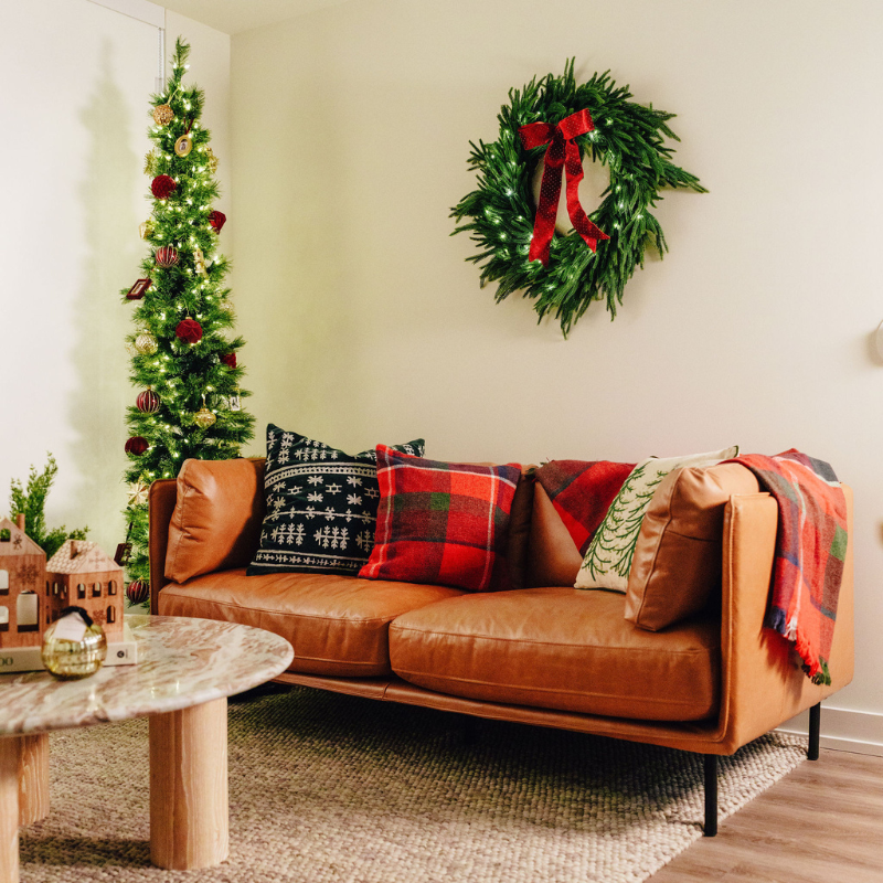 A living room decorated for the holidays.