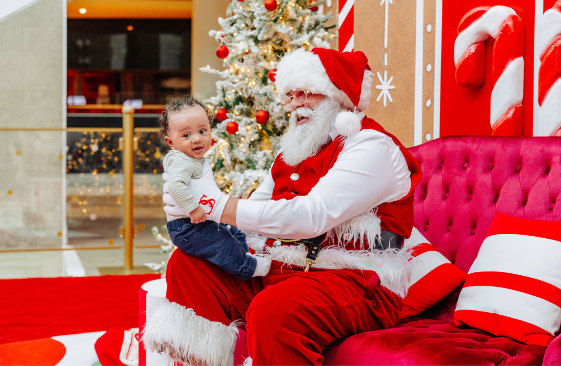A baby on Santa's lap.
