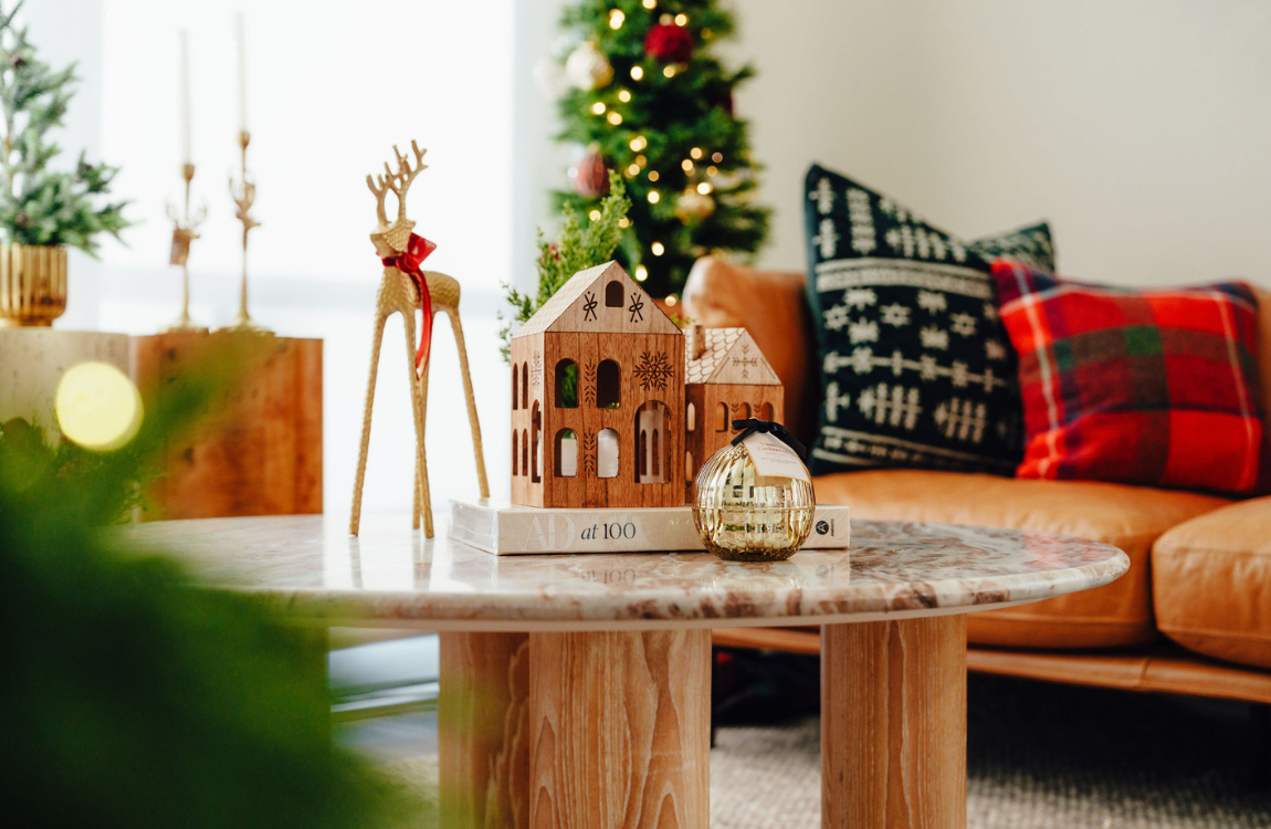A living room decorated with decor for the holidays.