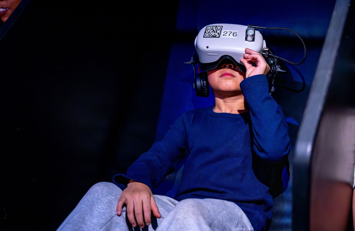 A boy wearing a VR headset