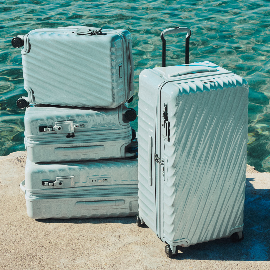 Tumi suitcases by the water