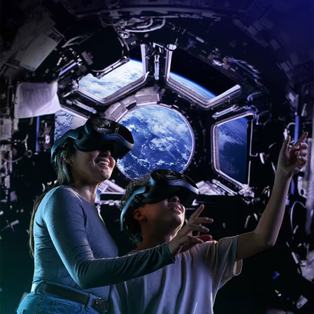 Two people wearing VR headsets